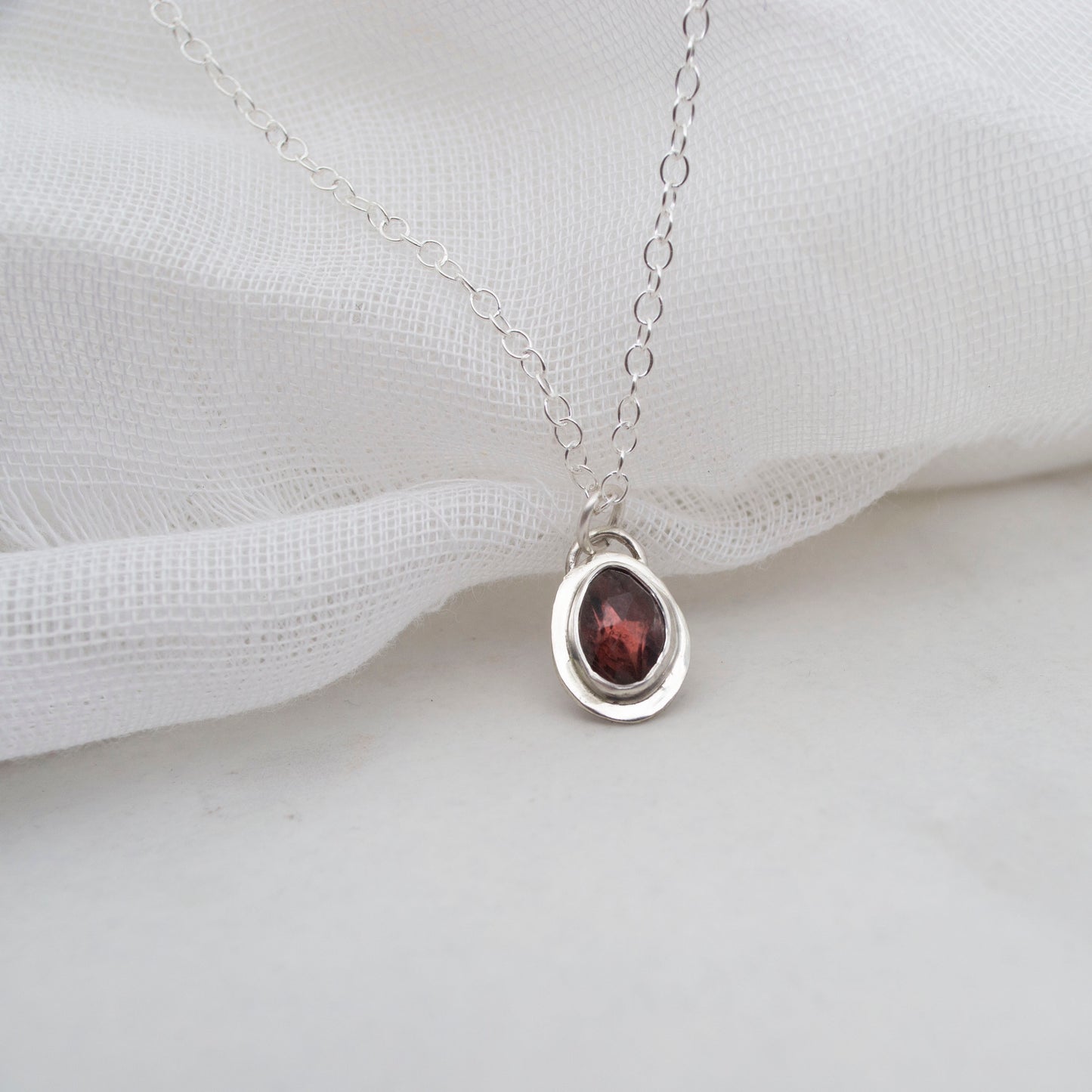 Framed Garnet and sterling silver pendant