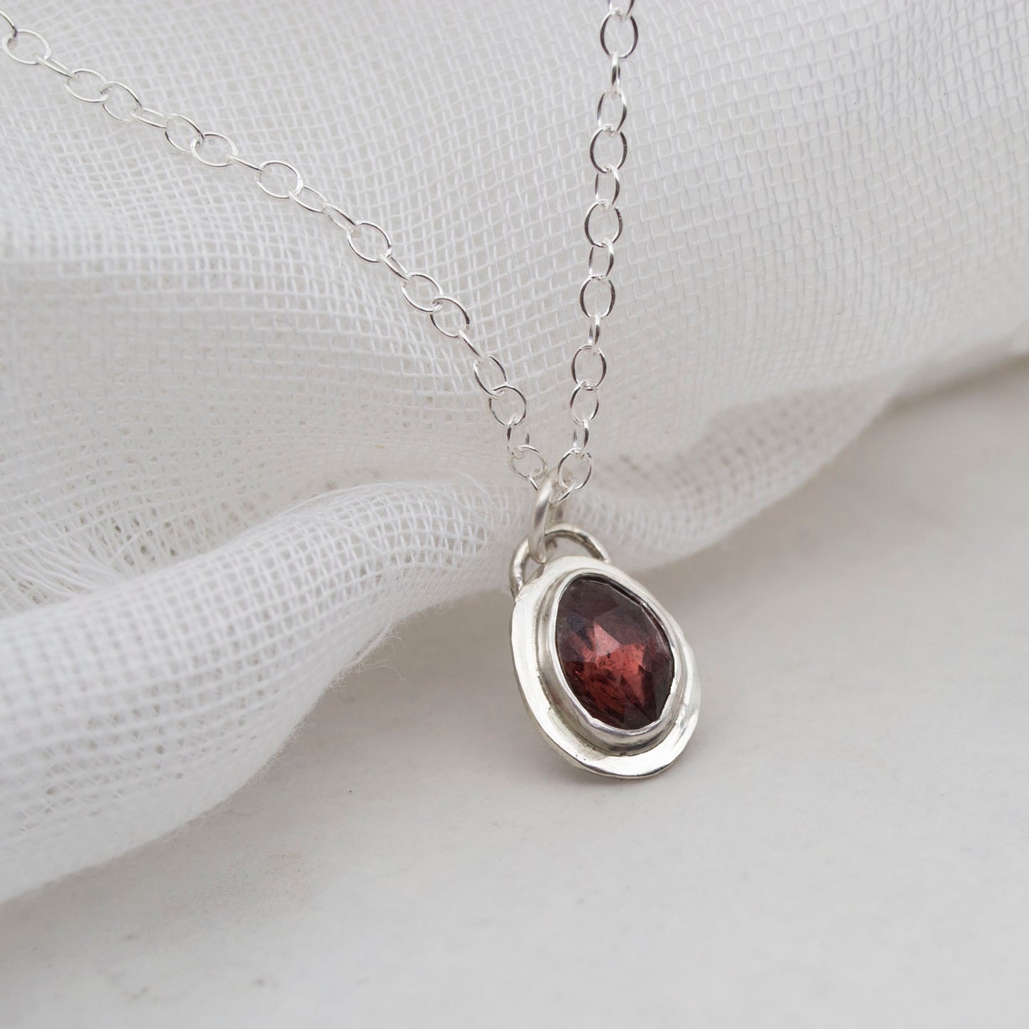 Framed Garnet and sterling silver pendant