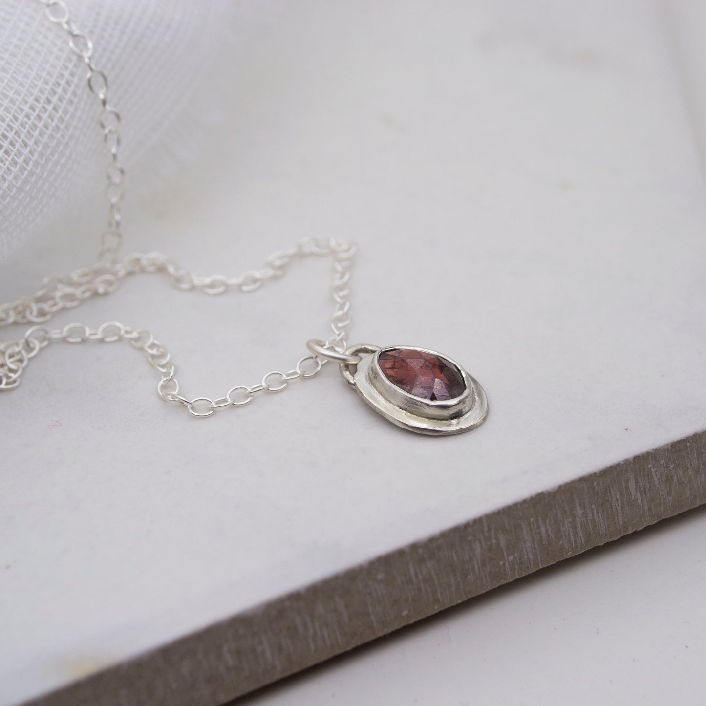 Framed Garnet and sterling silver pendant